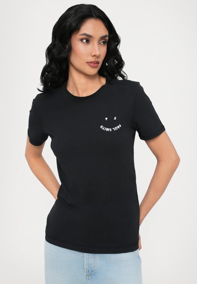 Black cotton t-shirt with short sleeves. Features a small white graphic text on the chest, round neckline, and regular fit.