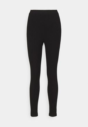 Black ribbed leggings with a fitted design and an elastic waistband, made from a stretchy fabric for comfort and flexibility.