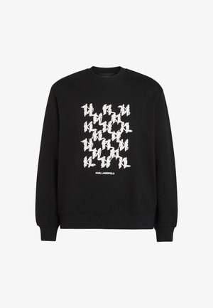 Czarna bluza z boldowym białym wzorem graficznym oraz napisem "KARL LAGERFELD" na dole. Wykonana z miękkiej bawełny.