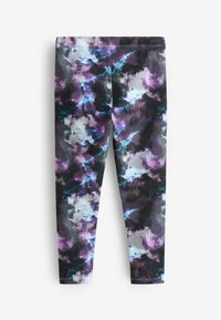 Collants présentant un motif abstrait multicolore dans des nuances de violet, noir et bleu, avec une texture lisse et un tissu extensible.