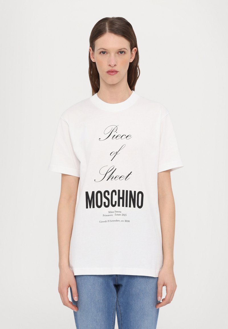 White cotton t-shirt featuring black printed text. Design includes "Piece of Sheet" and "MOSCHINO" prominently. Short sleeves and round neckline.