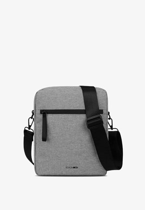 Grey fabric crossbody bag with a flat design, featuring a black zipper pocket, adjustable strap, and small logo on the front.