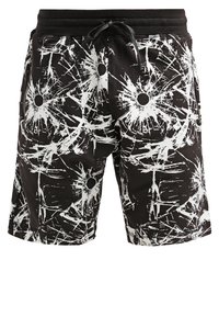 Shorts noirs à cordon avec des éclaboussures abstraites blanches et des motifs circulaires, poches avant et taille élastique.
