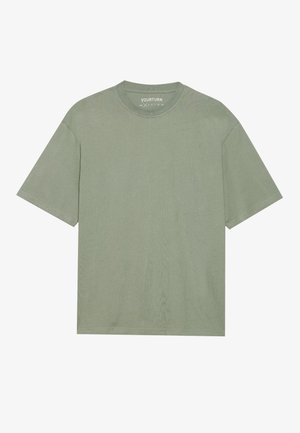 Green cotton t-shirt with a crew neckline, short sleeves, and a relaxed fit. Textured fabric with subtle vertical lines, no patterns or accents.