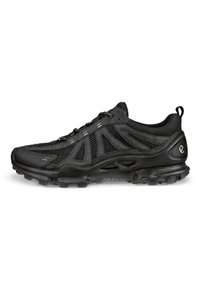 Black athletic shoes with a mesh upper, reinforced toe, textured sole, and reflective accents on the sides and laces for visibility.