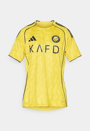 Yellow short-sleeve football jersey with wave pattern, black accents, and embroidered logo. Features crew neck and side stitching details.