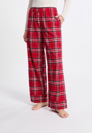 Rote karierte Lounge-Hosen aus weichem Material, mit einem elastischen Bund und Knöpfen sowie seitlichen Taschen. Locker sitzende, weit geschnittene Form.