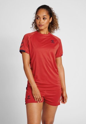 Red athletic shirt with short sleeves and blue accents, paired with matching red shorts, featuring a logo on the chest and thigh.