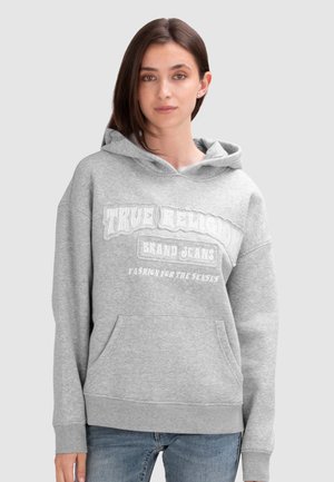 Grijze hoodie met een kangoeroe zak, voorzien van witte tekst "TRUE RELIGION BRAND JEANS" in gestileerd lettertype op de voorkant.