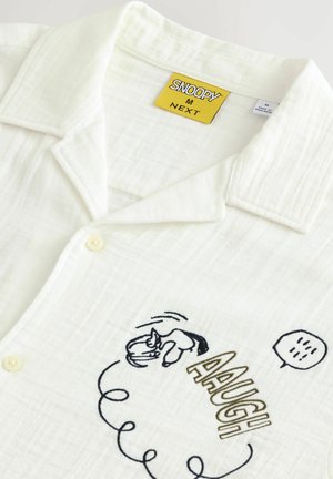Light cream short-sleeve shirt with a textured fabric, featuring Snoopy embroidery and the word "AAUGH" in bold letters and a speech bubble.