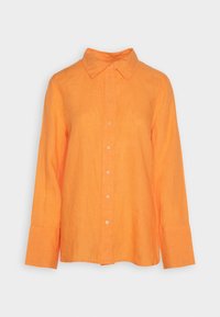 Camicia di lino arancione con colletto, maniche lunghe e chiusura a bottoni. Caratterizzata da una vestibilità comoda e una morbida texture.