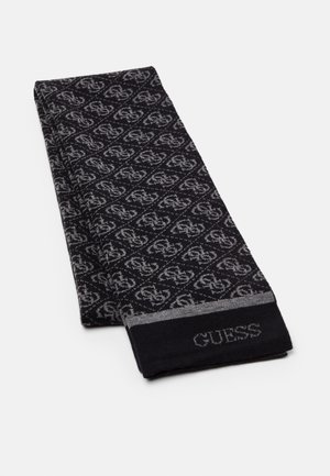 Foldet sort og gråt tørklæde med gentagende sammenlåst "G"-mønster og "GUESS"-tekst i den ene ende.