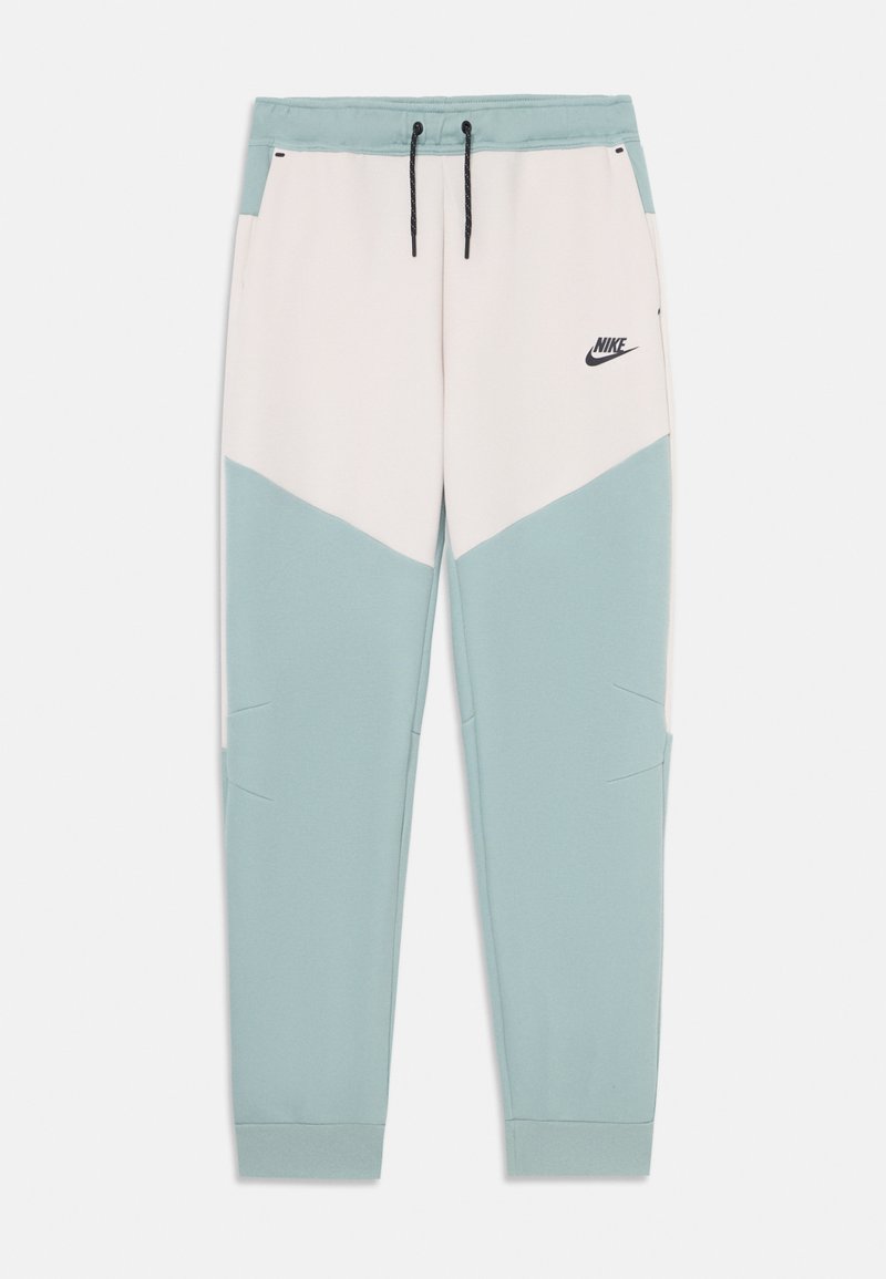 Nike φόρμες σε σχέδιο ζιγκ-ζαγκ, με μαλακό υλικό, σε παστέλ μπλε και κρεμ αποχρώσεις, ελαστική μέση και πλαϊνές τσέπες.