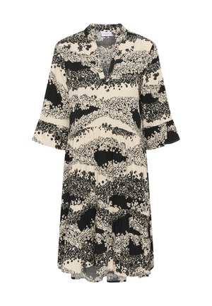 Cvetna obleka z črno-belo obarvanostjo, ki ima ovratnik, kratke rokave in tekoč, nabran obliko.