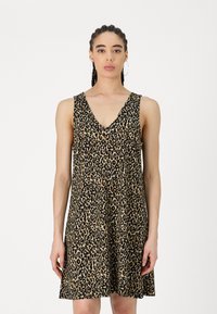 Haljina bez rukava s leopard uzorkom, V-izrezom, izrađena od mekanog materijala. A-linijska silueta, do koljena, s crnim detaljima na bež pozadini.