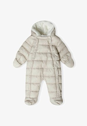 Gepolsterter Babyschneeanzug in hellbeige mit einem weichen weißen Innenfutter. Verfügt über ein gestepptes Design, elastische Bündchen und Füßchen. Kleine weiße Musterausschmückung.