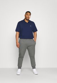 Lacoste Treniņtērpa apakšdaļas - pitch chine