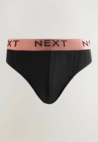Svart kalsong med en mjuk yta och ett brett rosa elastiskt midjeband med texten "NEXT" tryckt i svart. Framsidan har en klassisk skärning och veck.