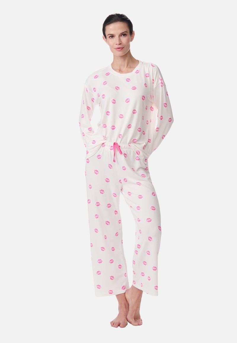 White pajama set with long sleeves and pants, featuring a repeated pink lip print and an elastic waistband with a pink drawstring.
