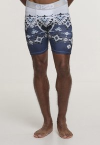 Boxer briefs con motivo in blu scuro, dotati di disegni geometrici in grigio e bianco. Realizzati in materiale elastico, presentano un cinturino elastico grigio.