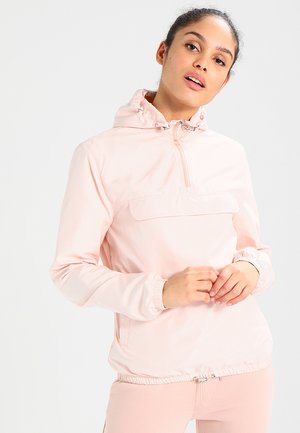 Hellrosa Windbreaker-Jacke mit Halb-Reißverschluss vorne, elastischen Bündchen, Kordelzug am Saum und einer Fronttasche. Glatte Textur und lässiges Design.