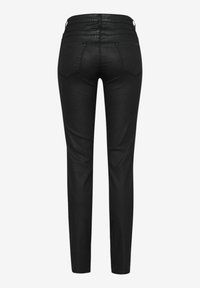 Pantalones ajustados negros con una textura suave. Presentan bolsillos traseros y costuras decorativas. Corte estrecho que se estrecha en los tobillos.