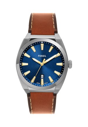 Men's Fossil wristwatch with blue textured dial, gold hour markers and hands, date window at 6 o'clock, and brown leather strap.