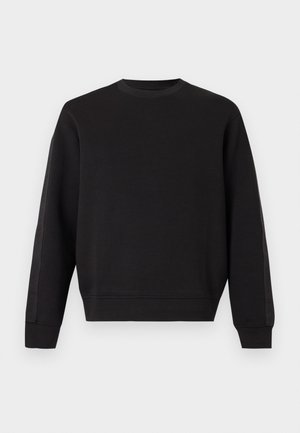 Sort langærmet crewneck-sweatshirt med ribstrikkede ærmekanter og kant, ensfarvet design, vist mod en lys baggrund.