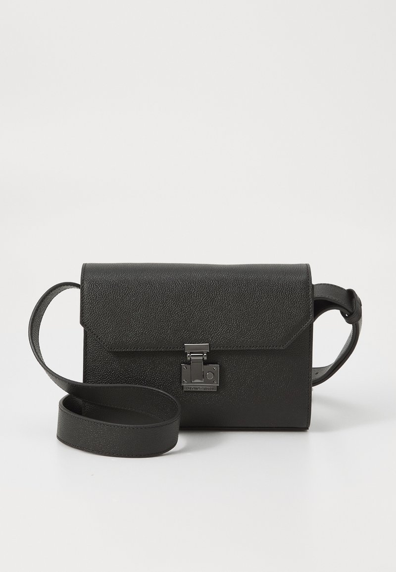 Black leather crossbody bag with a textured finish, flap closure, metal hardware, and a matching adjustable strap.