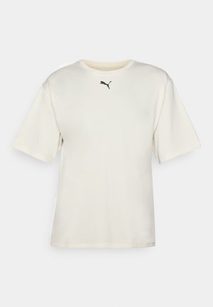 Creme kortærmet t-shirt, rund hals, lavet af glat stof. Har et lille sort Puma-logo i midten foran. Normal pasform.