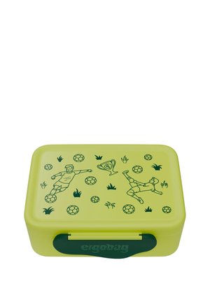 Green plastic lunch box with a smooth texture, featuring soccer player illustrations, balls, and a trophy against a bright yellow background.