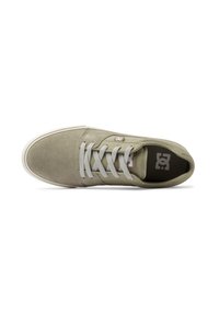 Light green suede sneaker with gray laces, rubber sole, and logo detail. The design features a rounded toe and smooth texture.