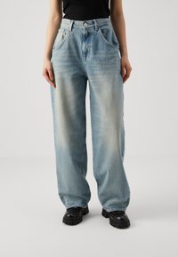 Light blue wide-leg jeans made of denim, featuring a high waist, five pockets, and a faded texture with subtle whiskering details.