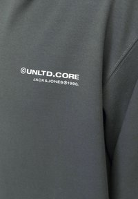 Grijze sweatshirt van een katoenmix met een gladde textuur, met een witte bedrukte logo "© UNLTD.CORE JACK&JONES® 1990."