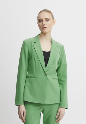 Zelený dámský blazer z hladké tkaniny s přiléhavým střihem, zapínání na jeden knoflík, klopové límce a dvě postranní kapsy.