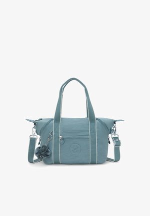 Borsa in tessuto color turchese con strisce bianche, doppi manici, tracolla rimovibile e tasca frontale con zip. Caratterizzata da un accessorio pom-pom.
