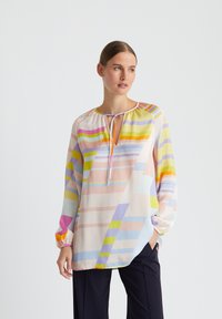 Bunte, leichte Bluse mit Rundhalsausschnitt, gerafften Manschetten und einer Mischung aus horizontalen und vertikalen Streifen in Pastellfarben.