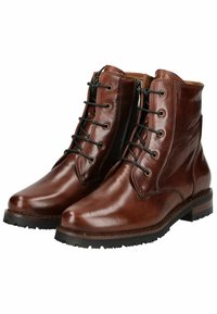 Botas de tobillo de cuero marrón con un acabado brillante, que cuentan con un cordón en la parte delantera, cremallera lateral y suelas resistentes para mayor tracción.