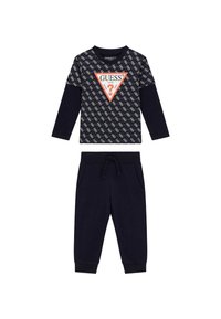 Marineblaues Zweiteiliges Outfit mit einem Langarmoberteil mit gemusterter Vorderseite und dreieckigem Logo; passende Jogginghosen mit elastischem Bund.