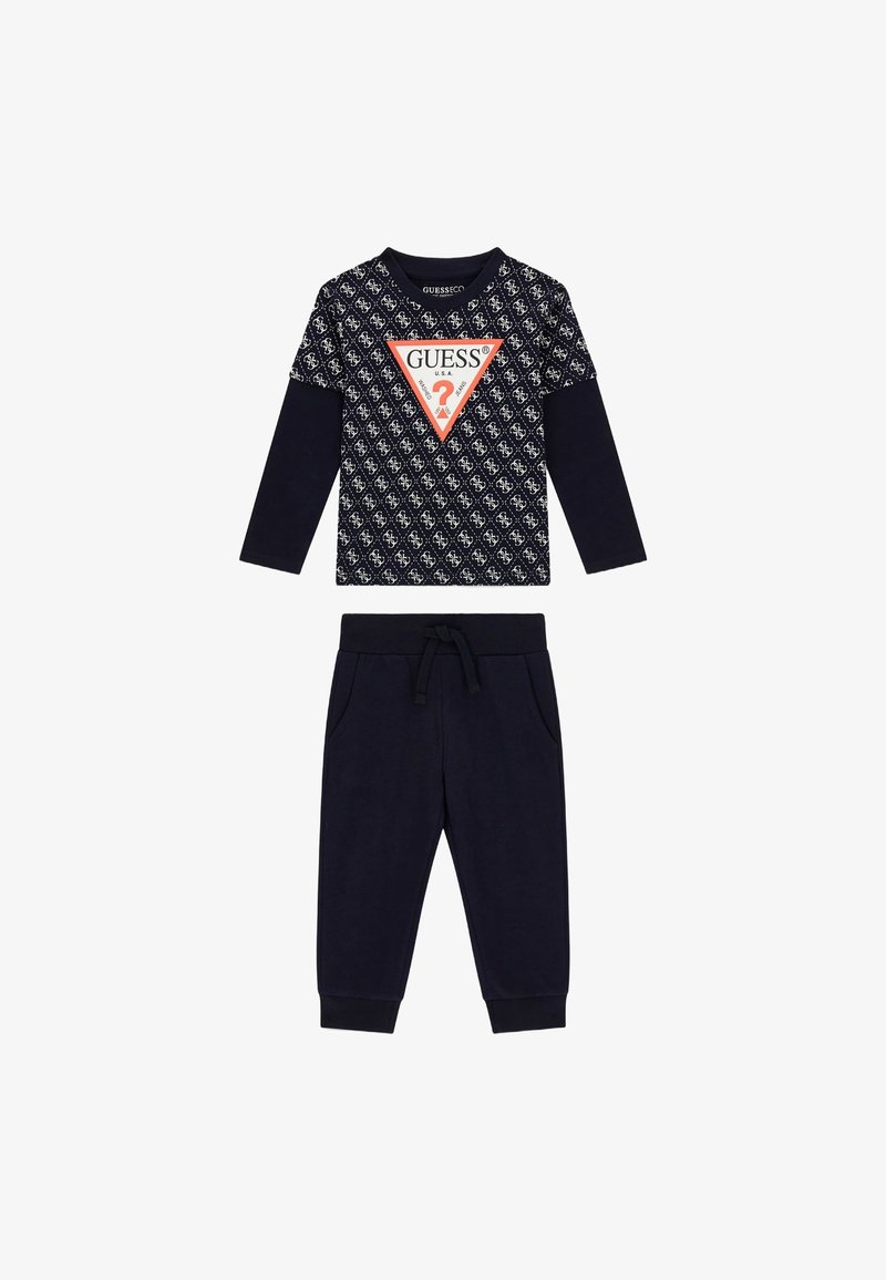 Marineblaues Zweiteiliges Outfit mit einem Langarmoberteil mit gemusterter Vorderseite und dreieckigem Logo; passende Jogginghosen mit elastischem Bund.