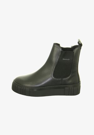 Black leather ankle boot with thick rubber sole, elastic side panel, and pull tab at the back, branded with "GANT" on the side.