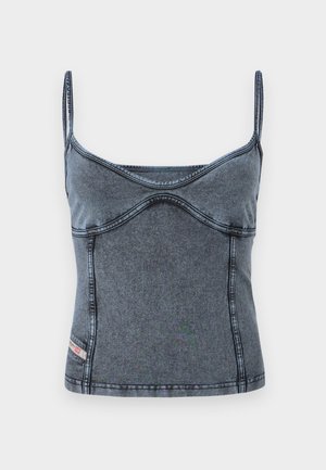 Denimo viršus su ploniais reguliuojamais petnešomis, prigludusi konstrukcija ir subtilia išlenkta siūlų detale tamsiai mėlynai pilko audinio.