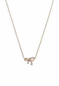 Collier en chaîne dorée avec un pendentif en forme de nœud orné de pierres scintillantes et transparentes. Le design présente des courbes douces et des maillons délicats.