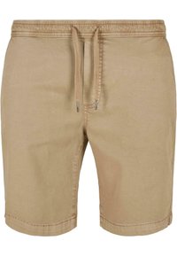 Pantaloni corti beige con vita elastica, chiusura a coulisse e materiale in cotone leggero. Presentano cuciture rinforzate e fondo dritto.