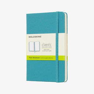 Turquoise Moleskine classic collection hardcover plain notebook with elastic closure and paper label band.