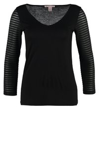 Schwarzes Oberteil mit V-Ausschnitt und langen Ärmeln in transparenter gestreifter Ausführung. Der Stoff wirkt glatt mit leichtem Stretch.