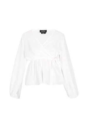 Blouse blanche à manches longues, taille froncée et détail de nœud. Fabriquée dans un tissu doux, avec un décolleté en V.