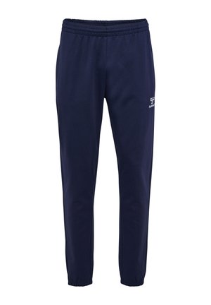 Pantaloni della tuta blu navy con vita elasticizzata e polsini alla caviglia, con un piccolo logo bianco Hummel sulla parte superiore della coscia sinistra.