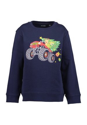 Sweat-shirt bleu marine avec une illustration d'un monster truck rouge transportant un sapin de Noël, un renne, un dinosaure vert et des boîtes-cadeaux colorées.
