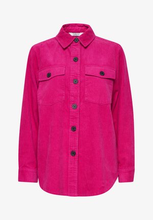 Chemise en velours côtelé fuchsia avec un devant à boutons, deux poches poitrine, boutons noirs, manches longues et un ourlet arrondi.